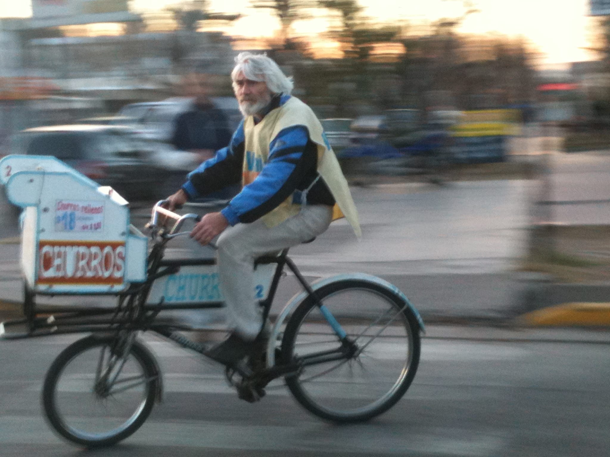 Argentine churros vender biking in Mendoza
