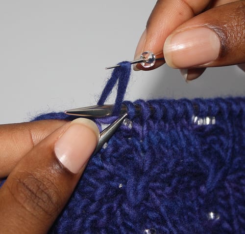 Beading with a crochet hook step 3 - hook top loop of stitch with crochet hook