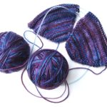 Purple malabrigo socks in progress, two at a time