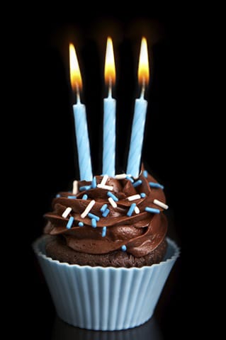 cupcake with three candles