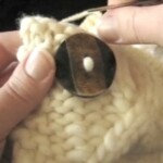 22 Bulky Cabled Legwarmers Sewing on Buttons video screenshot 082022