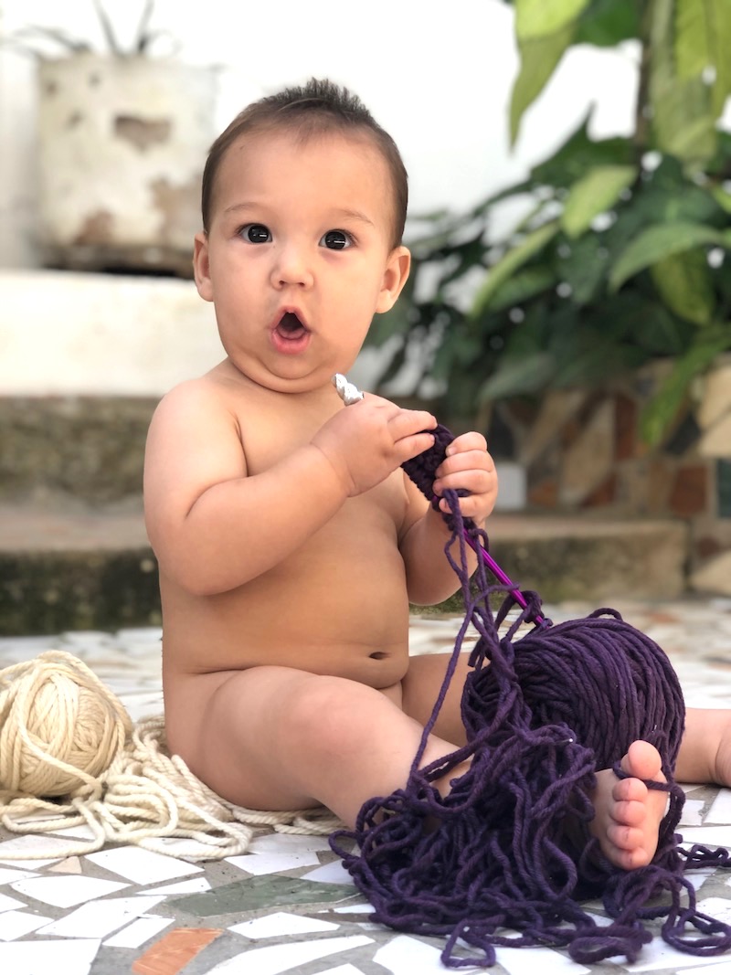 Baby Milo with Knitting Needles