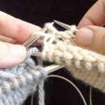 Two-at-a-time socks in process of being transferred from one set of circular needles to the other