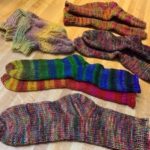 Student-knit array of toe-up sock successes