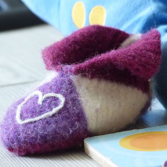 Felted slipper with puzzle and plush dinosaur square crop sm