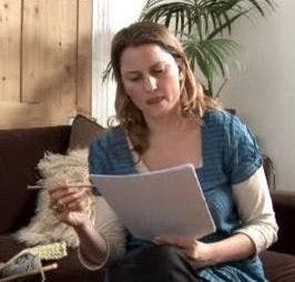 woman reading a knitting pattern