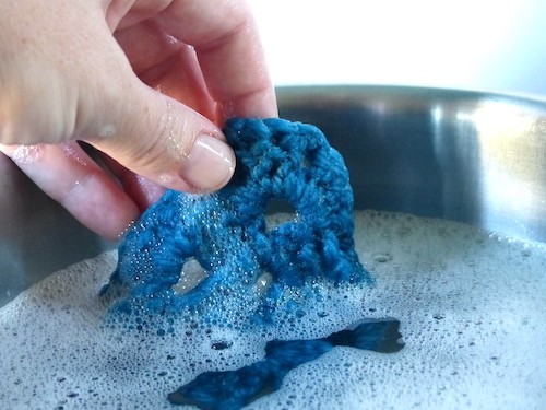 Blocking crochet swatch in water